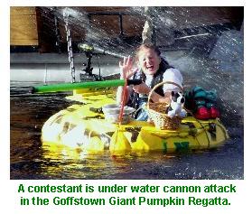 Contestants come under fire by water cannon in the Goffstown Giant Pumpkin Regatta.